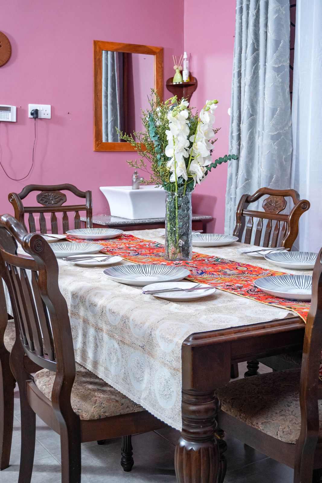 Dining table set for a family meal with flowers